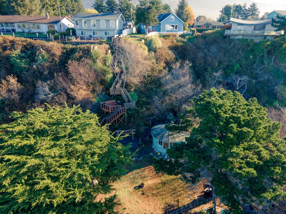 A view from the air looking from the west side to the house perched atop the bluff