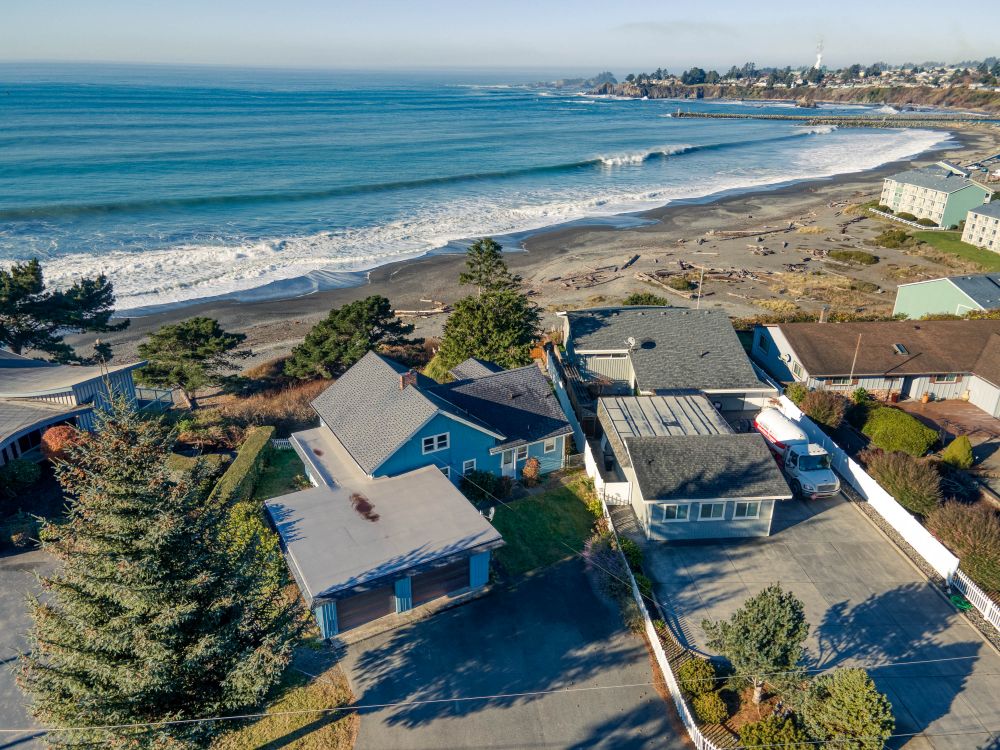 An aerial view of Sunset Cabin showing the street side looking toward the west and over the Pacific