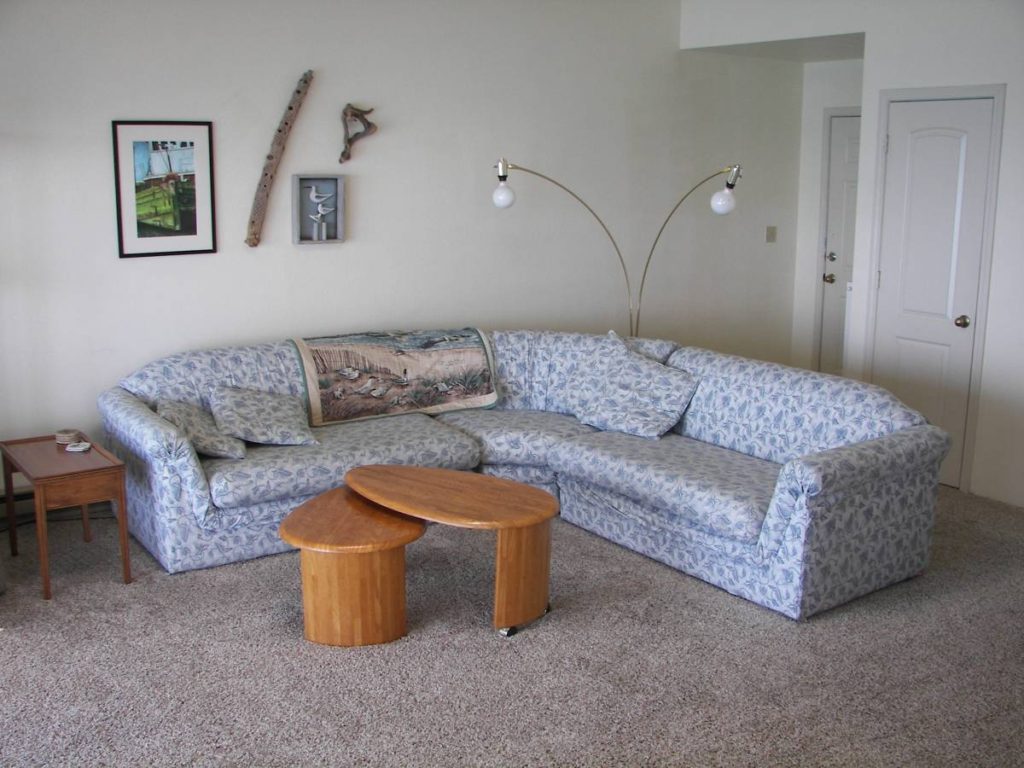 Photo of comfortable L shaped couch and coffee table at Brookings Sea Haven