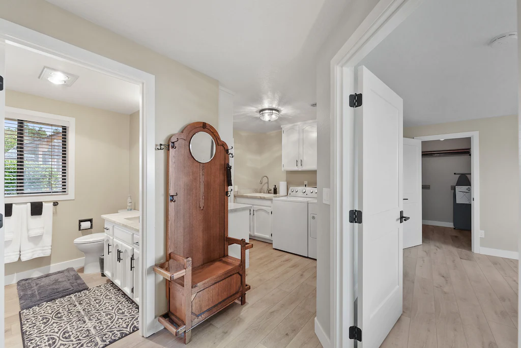 Hallway looking into Laundry room and main bathroom at Harris Beach Overlook, a Brookings Vacation Rental