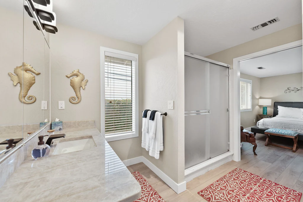 Main bedroom & bathroom at Harris Beach Overlook, a Brookings Vacation Rental