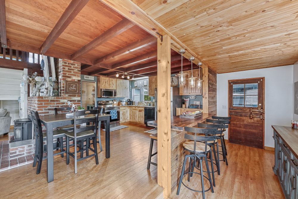 Photo of breakfast bar, dining area, and kitchen at Sunset Cabin