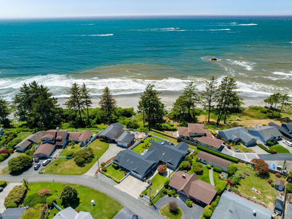 Aerial looking at Paradise Found (blue chairs) and proximity to ocean