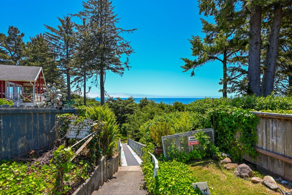 A photo of the beach path at Paradise Found