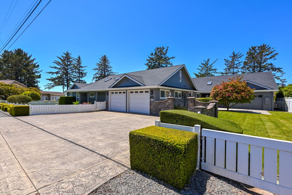 A photo of the garage & entry gate to walk into Paradise Found