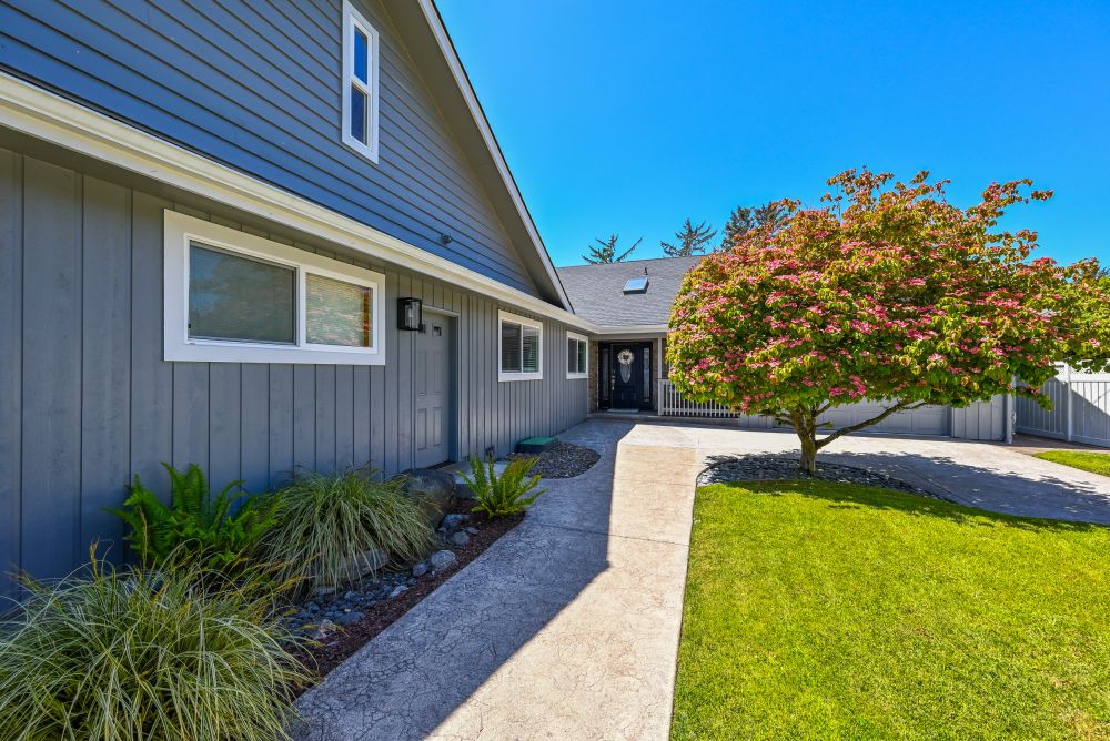 A photo of the front yard and garage (game room) at Paradise Found