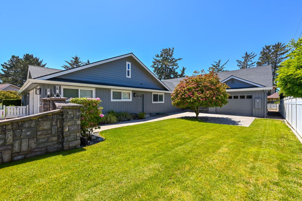 A photo of the front yard and garage (game room) at Paradise Found
