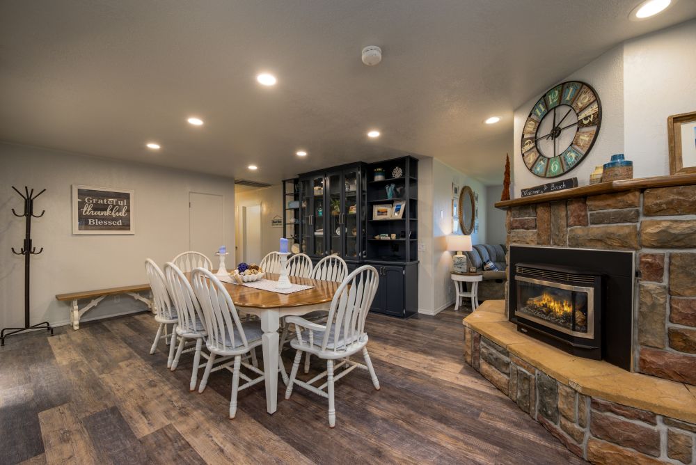 A photo of the great room and dining with two sided fireplace