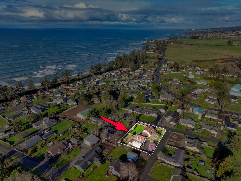 An aerial view of Winchuck River Homestead showing the location of the home as it relates to the river and ocean.