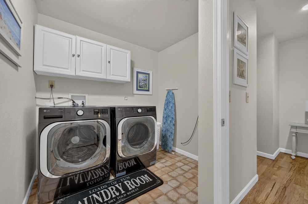 Laundry equipment at Day Dreamin', A Brookings Vacation Rental Home