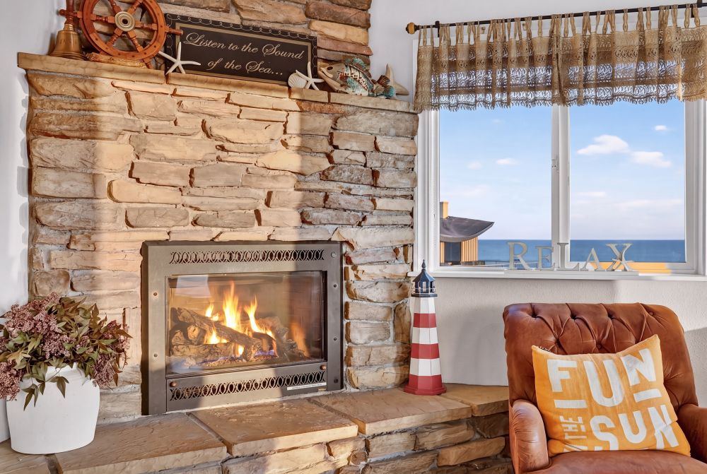 Comfortable Fireplace and seating with an ocean view - Day Dreamin', A Brookings Vacation Rental Home